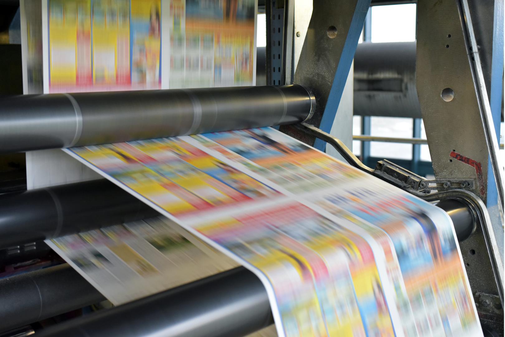 Commercial printing press at Fresh Prints in San Diego
